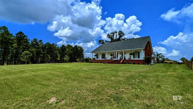 view of front of property with a porch and a front yard