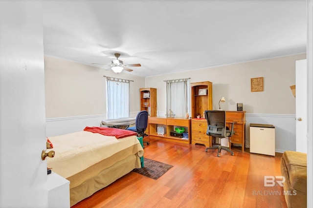 45 Caisson Trce, Spanish Fort, AL 36527 - bedroom featuring wood finished floors, a desk, refrigerator, crown molding, and a ceiling fan