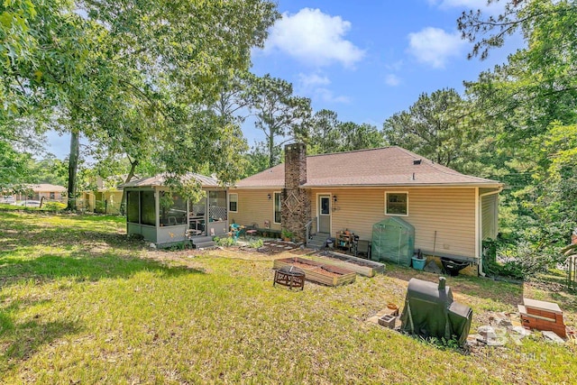 45 Caisson Trce, Spanish Fort, AL 36527 - rear view of property featuring a sunroom, a chimney, and entry steps