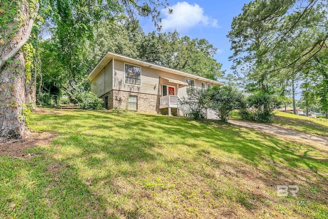 45 Caisson Trce, Spanish Fort, AL 36527 - rear view of property featuring a lawn and brick siding
