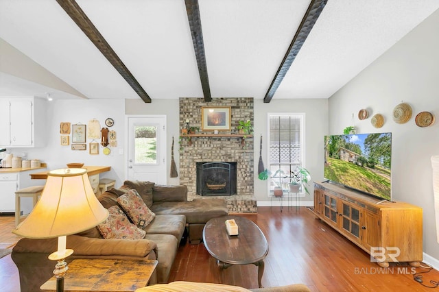 45 Caisson Trce, Spanish Fort, AL 36527 - living room featuring wood finished floors, beamed ceiling, and a brick fireplace