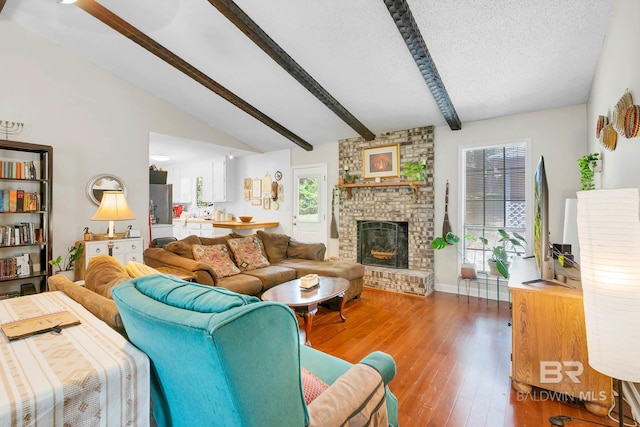 45 Caisson Trce, Spanish Fort, AL 36527 - living room with a brick fireplace, light wood-style flooring, and a textured ceiling