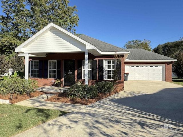 view of front of home featuring brick siding, a porch, concrete driveway, a garage, and roof with shingles