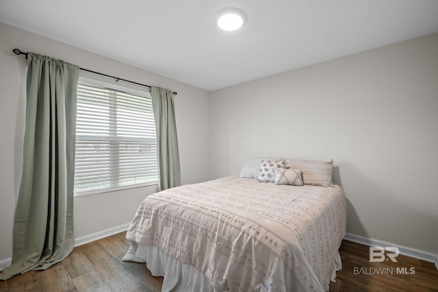 17208 Muse St, Loxley, AL 36551 - bedroom featuring baseboards and wood finished floors