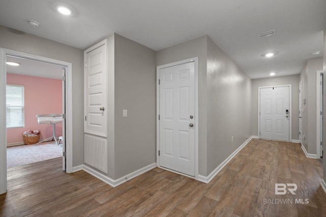 17208 Muse St, Loxley, AL 36551 - corridor with wood finished floors, baseboards, and recessed lighting