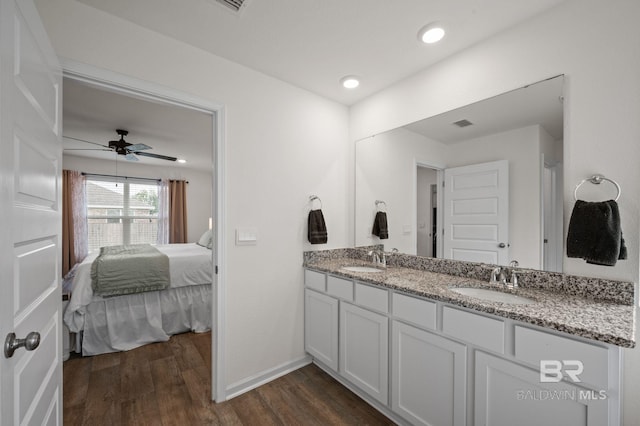 17208 Muse St, Loxley, AL 36551 - bathroom with double vanity, wood finished floors, baseboards, a ceiling fan, and recessed lighting