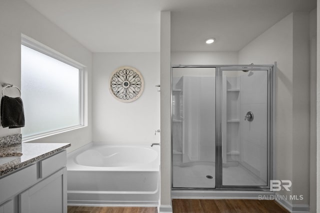 17208 Muse St, Loxley, AL 36551 - full bathroom with a stall shower, a bath, wood finished floors, and vanity