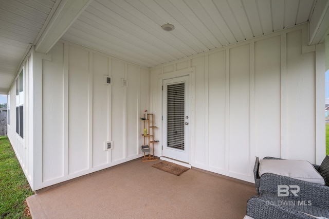 17208 Muse St, Loxley, AL 36551 - doorway to property featuring board and batten siding and a patio area