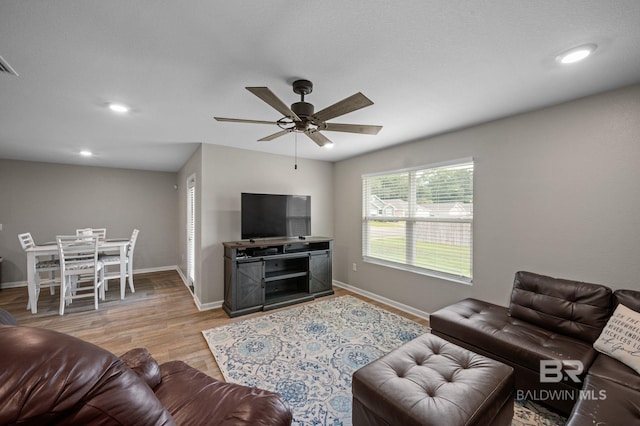 17208 Muse St, Loxley, AL 36551 - living room featuring ceiling fan, baseboards, wood finished floors, and recessed lighting