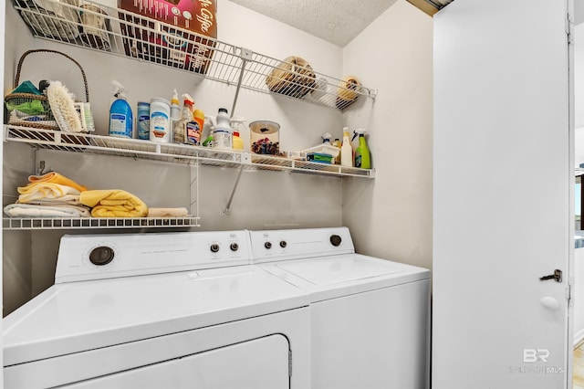 28783 Perdido Beach Blvd Unit 512N, Orange Beach, AL 36561 - laundry area featuring washer and clothes dryer and a textured ceiling