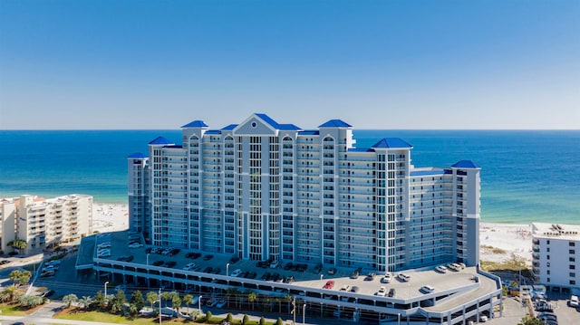 birds eye view of property with a view of the beach and a water view