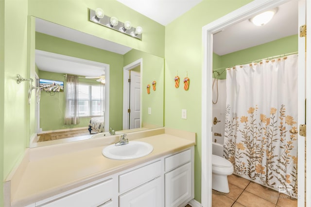 full bathroom featuring shower / tub combo, toilet, tile patterned floors, ensuite bathroom, and vanity