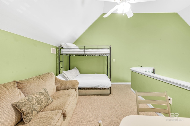 carpeted bedroom featuring lofted ceiling, baseboards, visible vents, and ceiling fan