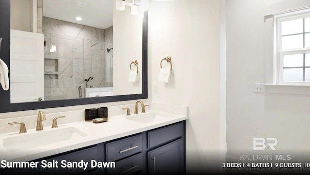 2760 Salt Dr, Orange Beach, AL 36561 - bathroom with a healthy amount of sunlight, tiled shower, and a sink
