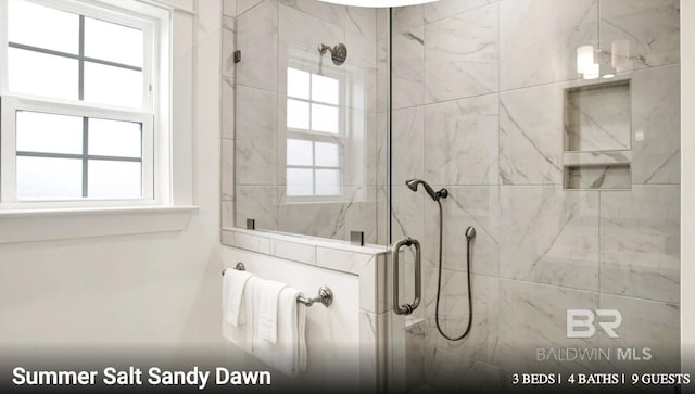 2760 Salt Dr, Orange Beach, AL 36561 - full bathroom featuring a marble finish shower