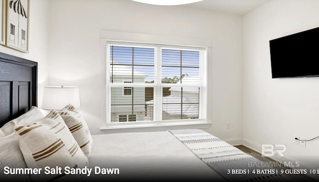 2760 Salt Dr, Orange Beach, AL 36561 - bedroom with wood finished floors and baseboards