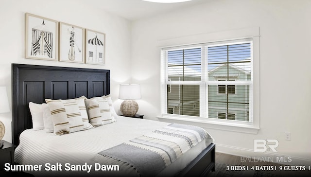 2760 Salt Dr, Orange Beach, AL 36561 - bedroom featuring wood finished floors and baseboards
