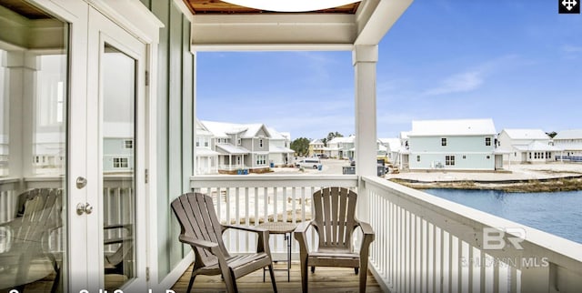 2760 Salt Dr, Orange Beach, AL 36561 - balcony featuring a water view, a residential view, and french doors