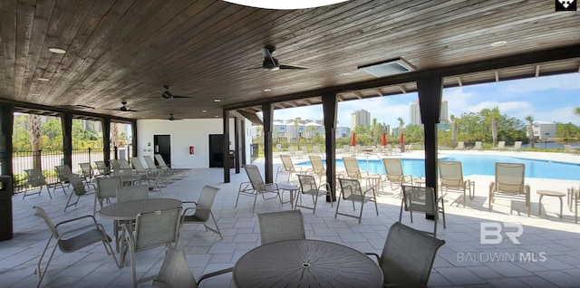 2760 Salt Dr, Orange Beach, AL 36561 - view of patio featuring fence, a ceiling fan, and a community pool