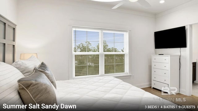 2760 Salt Dr, Orange Beach, AL 36561 - bedroom with baseboards, a ceiling fan, and wood finished floors
