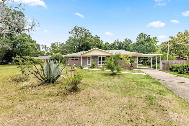 7410 Helton Dr, Foley, AL 36535 - ranch-style home featuring driveway, a carport, and brick siding