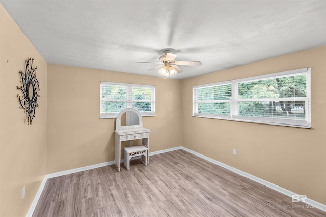 7410 Helton Dr, Foley, AL 36535 - empty room featuring light wood-type flooring, ceiling fan, and baseboards