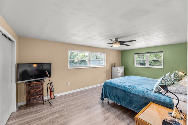 7410 Helton Dr, Foley, AL 36535 - bedroom with multiple windows, wood finished floors, baseboards, and ceiling fan