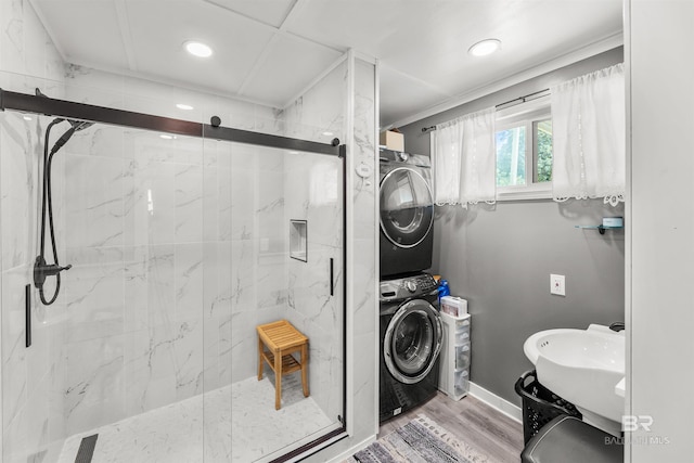 7410 Helton Dr, Foley, AL 36535 - full bath with stacked washer / drying machine, a marble finish shower, recessed lighting, baseboards, and wood finished floors