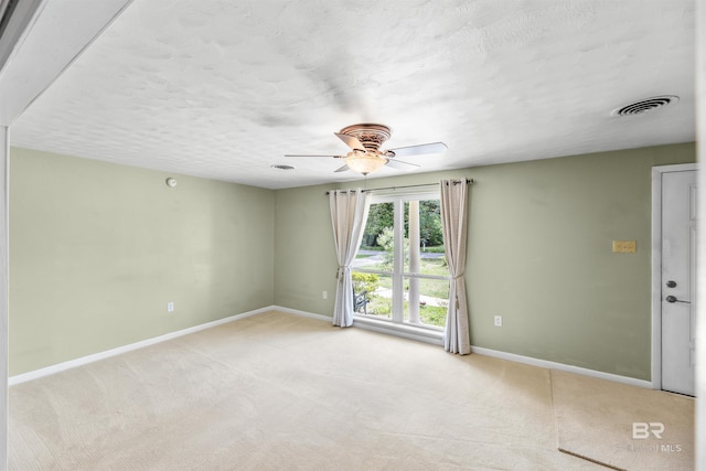 7410 Helton Dr, Foley, AL 36535 - empty room featuring baseboards, ceiling fan, light carpet, and a textured ceiling