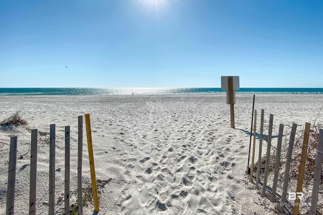 property view of water featuring a beach view