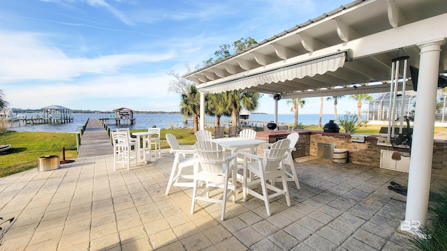 view of patio / terrace with a dock, area for grilling, outdoor dining area, and a water view