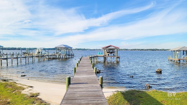 dock area with a water view and boat lift