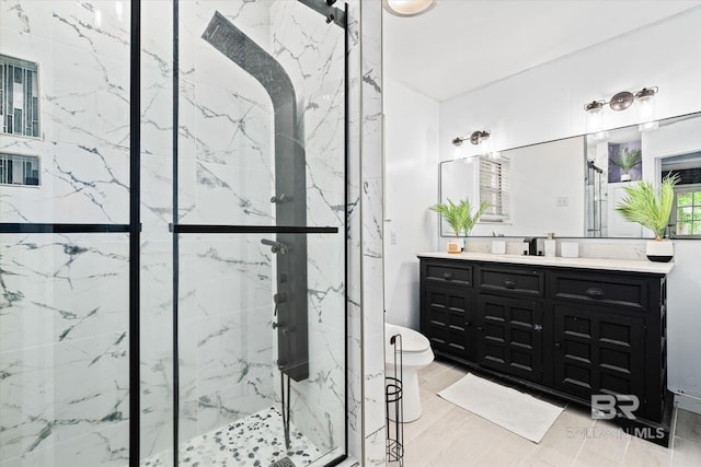 bathroom featuring toilet, wood-type flooring, vanity, and a shower with shower door