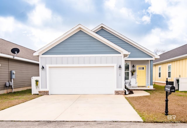 view of front of property featuring a garage and a front lawn