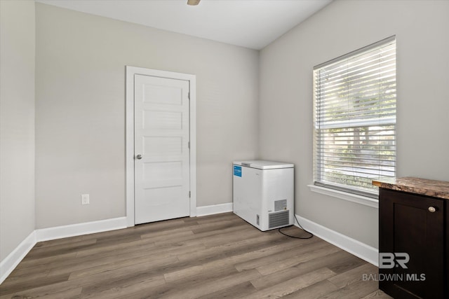 empty room with light hardwood / wood-style floors