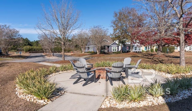 view of patio with a fire pit