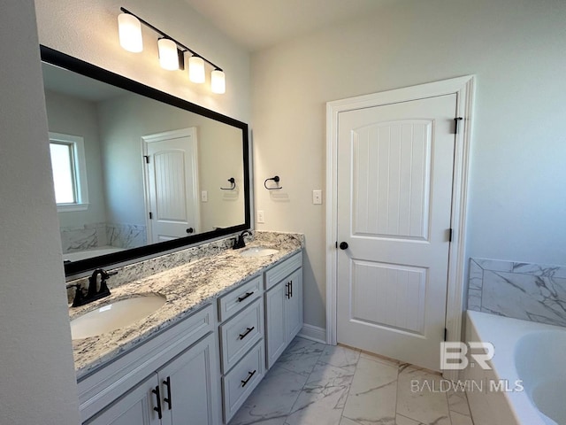 bathroom featuring vanity and a bathtub