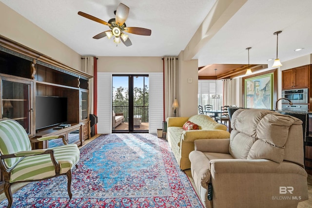 living room with ceiling fan