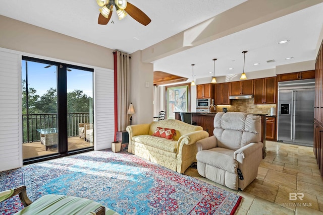 living room featuring ceiling fan