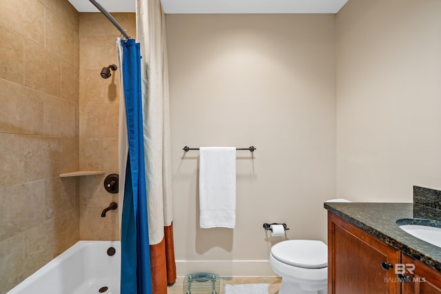 full bathroom with vanity, shower / tub combo, and toilet