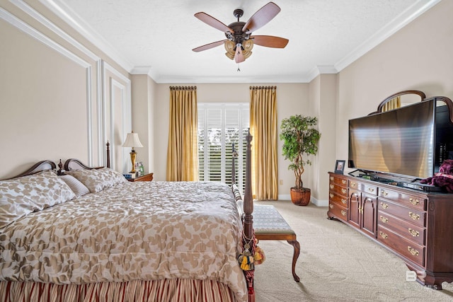 bedroom with a textured ceiling, light colored carpet, ceiling fan, and ornamental molding