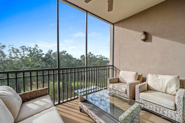 sunroom featuring ceiling fan