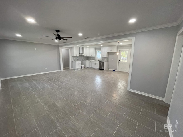 unfurnished living room with ornamental molding and ceiling fan