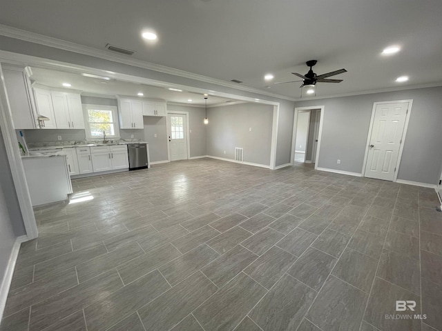 unfurnished living room featuring crown molding, sink, and ceiling fan