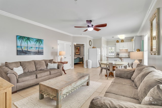 living area featuring light tile patterned floors, ceiling fan, and ornamental molding