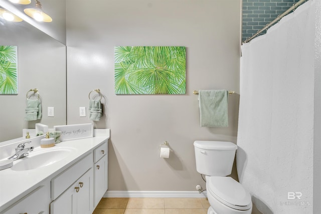 full bathroom with tile patterned flooring, baseboards, vanity, and toilet