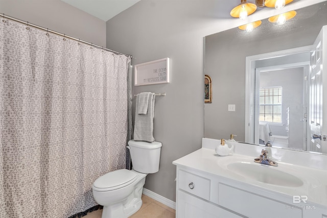 full bathroom with baseboards, vanity, toilet, and tile patterned floors