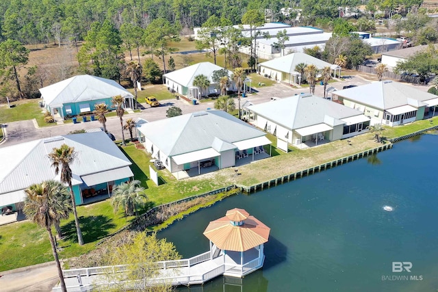 bird's eye view featuring a water view and a residential view