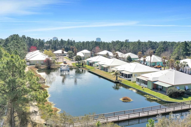 birds eye view of property with a water view and a residential view