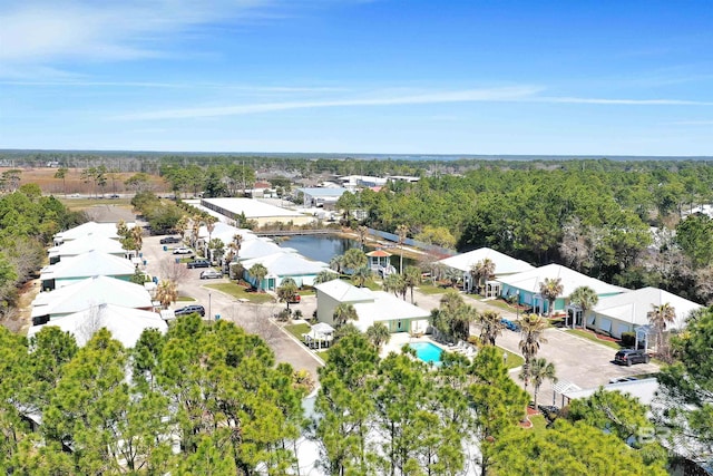 bird's eye view featuring a wooded view